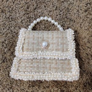 Elegant faux pearls handbag